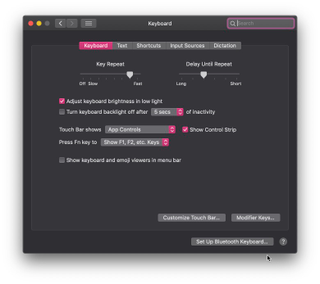 Can you find the button that lets you customize the Touch Bar and kill the Siri button?